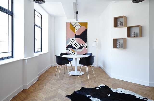 scandinavian living room with light wood floors and cozy textiles